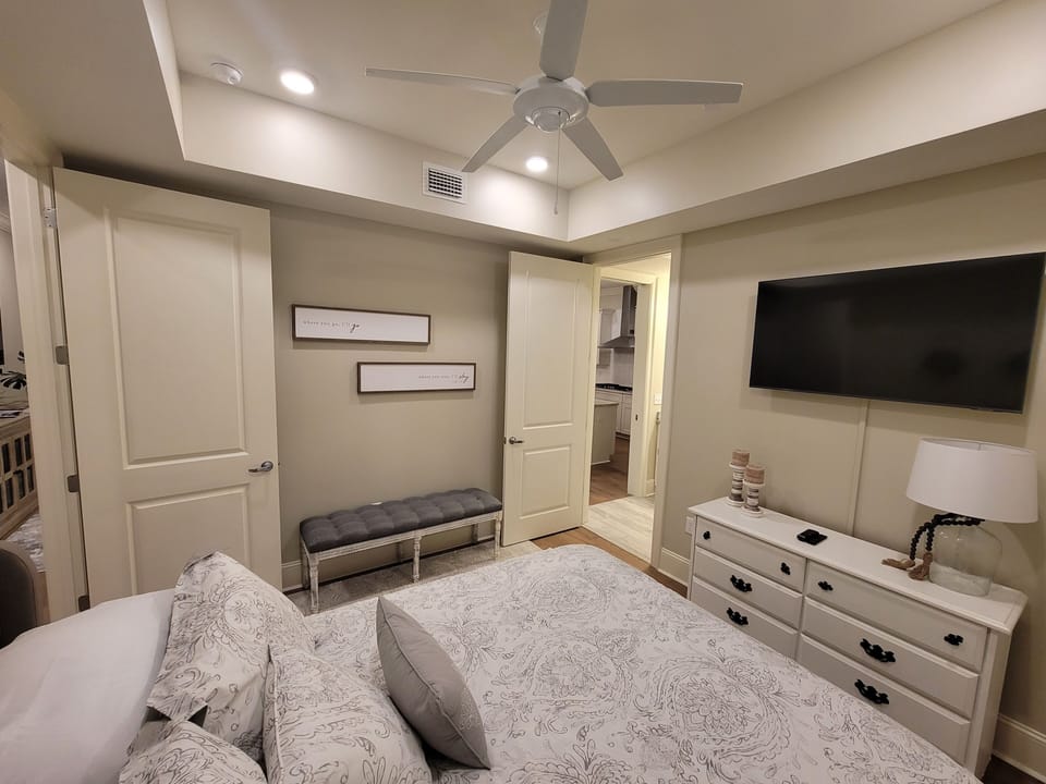Queen bedroom  / access door to full bath / TV / ceiling fan