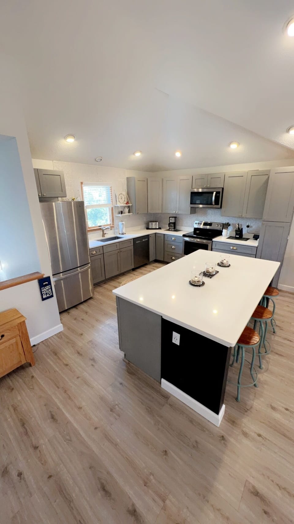 The large island anchors this kitchen space, for family style dining. 