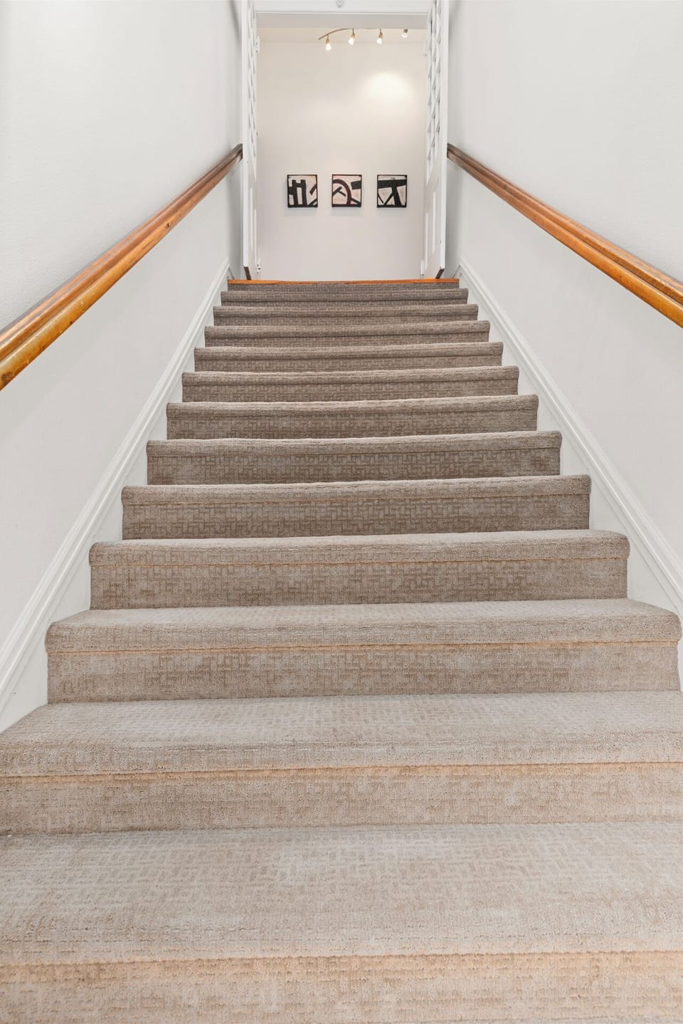 Private stair entry to the quiet top-floor corner condo
