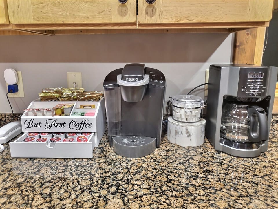 Coffee/tea station with drip coffee maker and Keurig coffee maker.