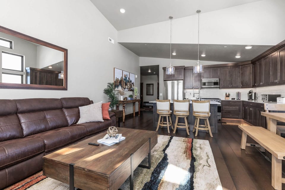 Cozy sofa set with a glimpse of the kitchen.