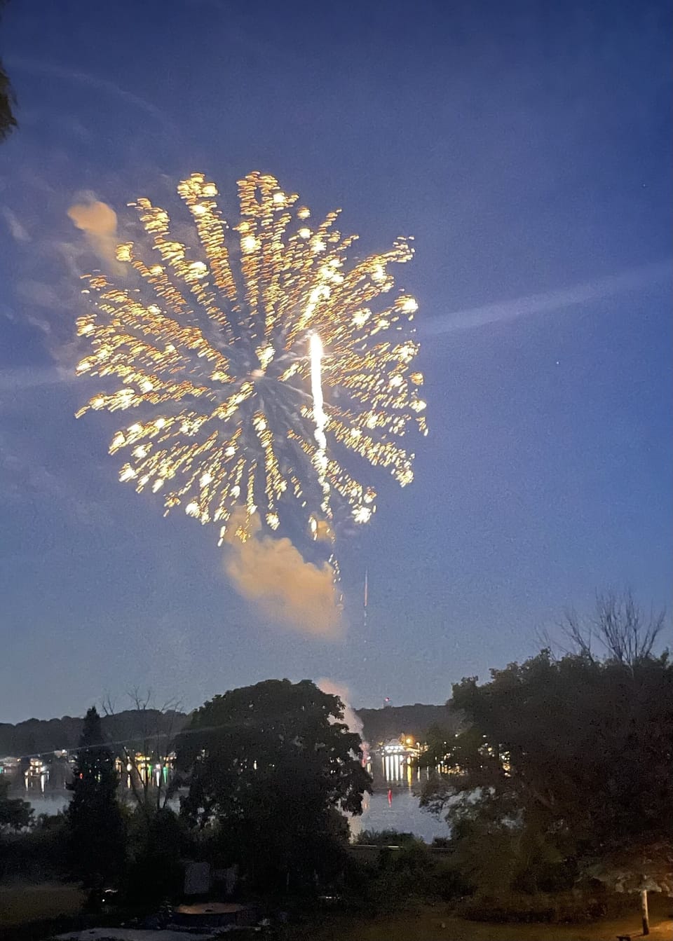 View of 4th of July fireworks over the lake from patio