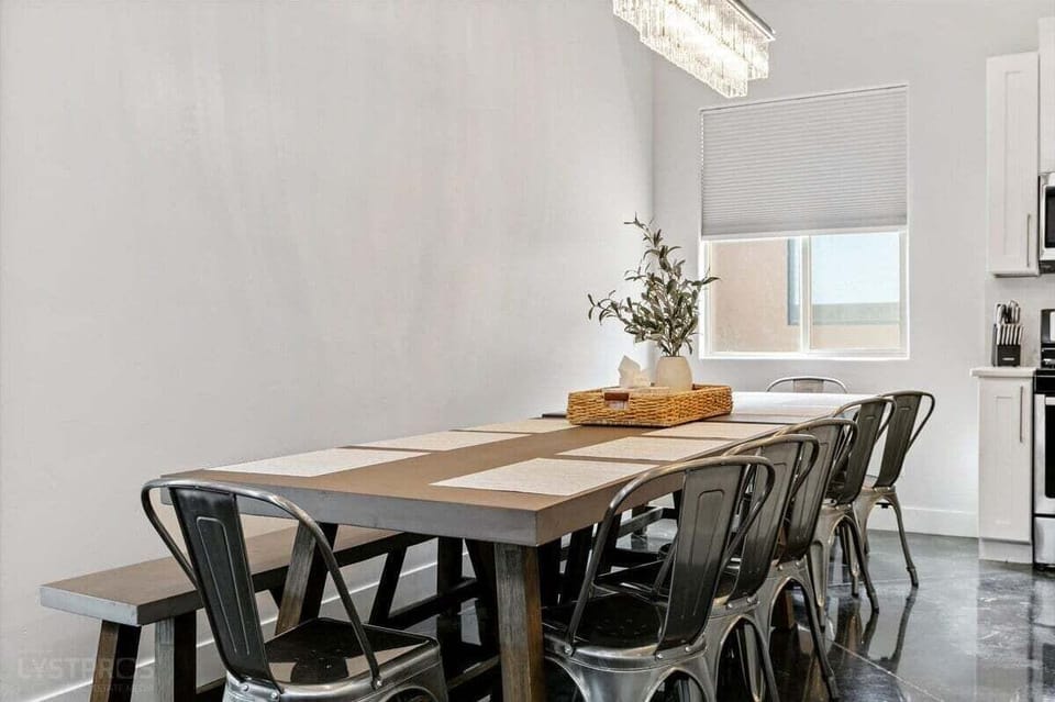 Enjoy meals in this beautiful dining area, highlighted by a large farmhouse table with seating for 12. The combination of natural wood and elegant details sets the stage for lively dinners and special celebrations.