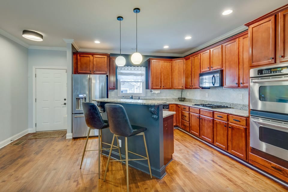 There is a gas stove, microwave, oven, and tons of cabinet space 