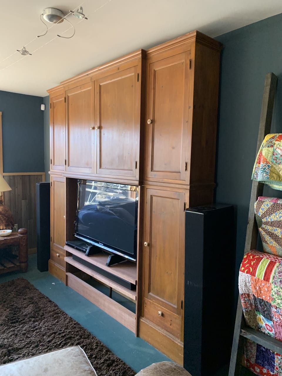 Movies and games are tucked in the shelves