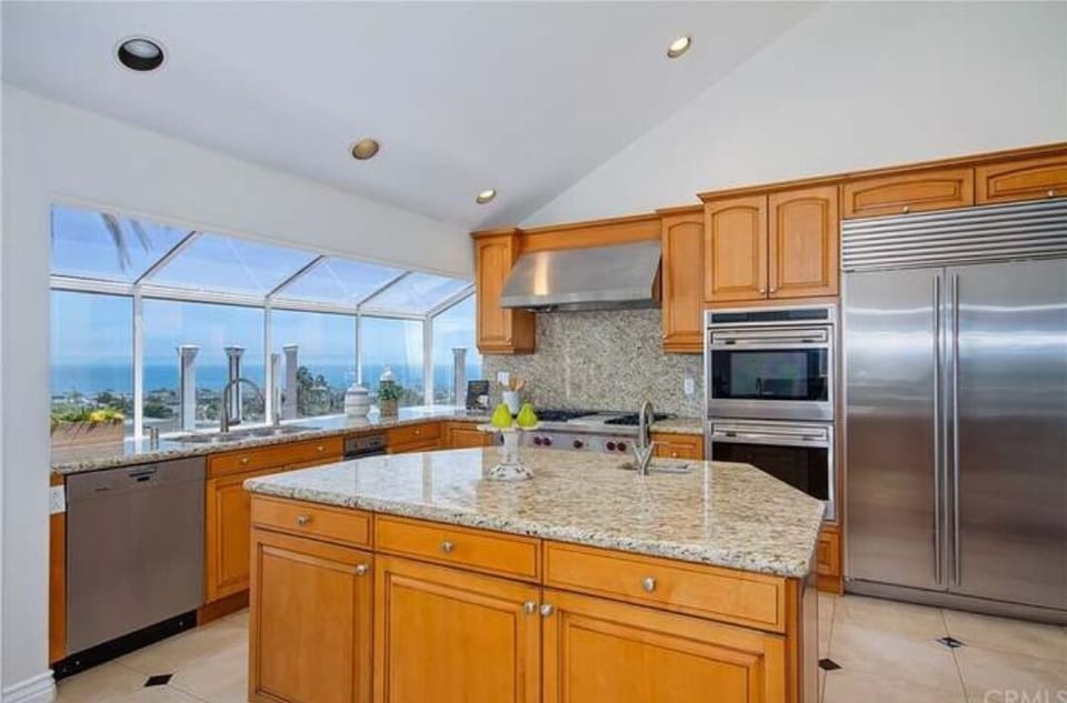 Kitchen with upscale appliances and sweeping ocean views.
