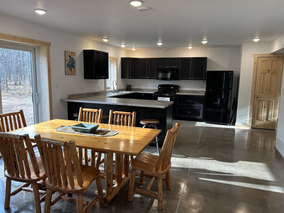 Dining room to kitchen with sliding door to the patio.