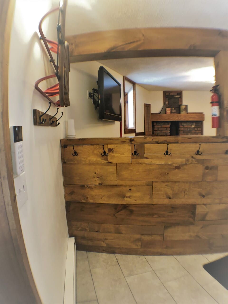 View from basement/mudroom door over into basement living room.