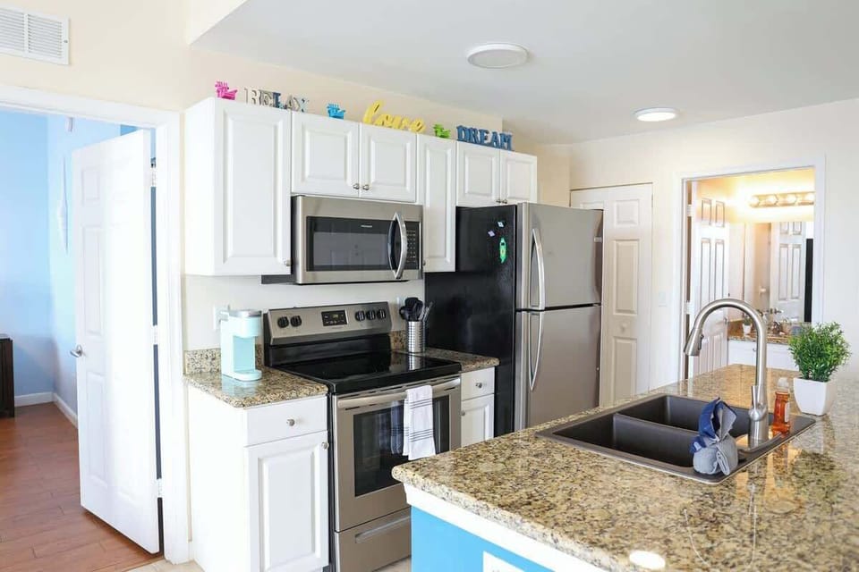 Fully equipped kitchen in our top floor, bay front view apartment in Boca Ciega Resort, St. Petersburg.