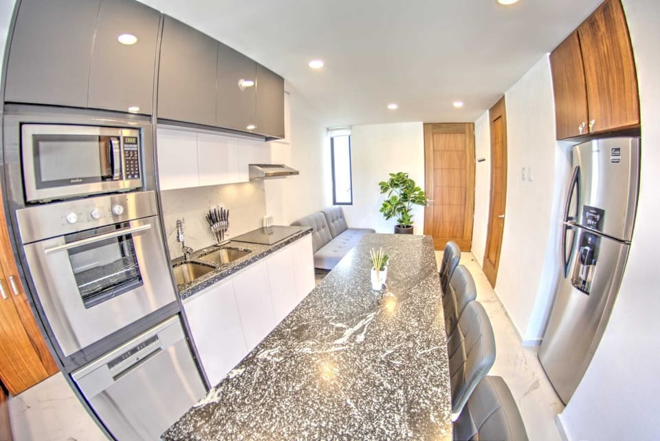 Fully-equipped kitchen with oven and dishwasher