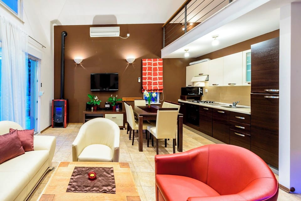 Open plan living room with kitchen and dining area