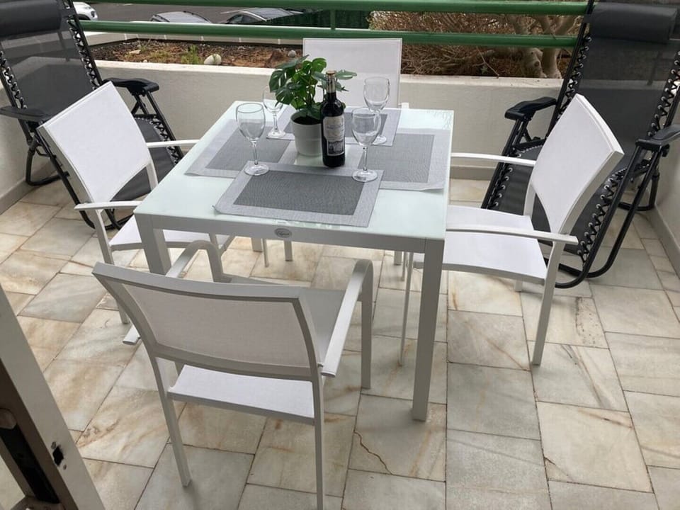 Outside balcony, dining furniture with recliners