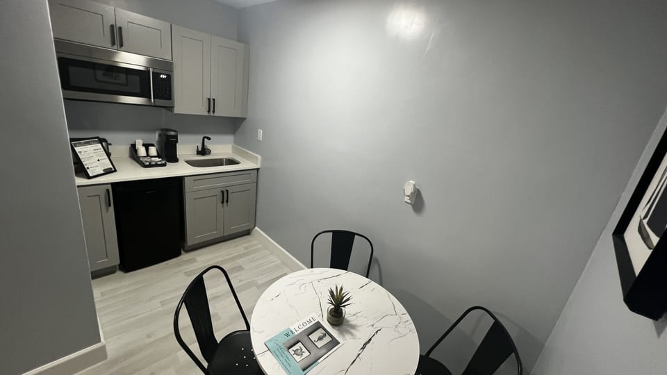 Kitchenette is equipped with mini fridge, microwave, toaster, coffee machine