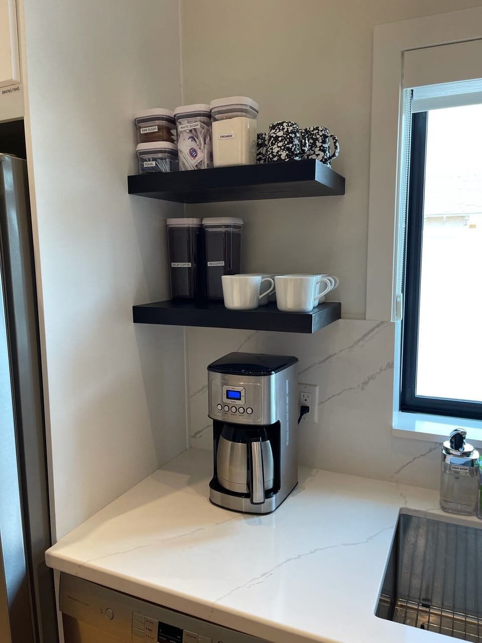 Drip coffee maker. Reg & decaf coffee, creamer, sugars & artificial sweetener.