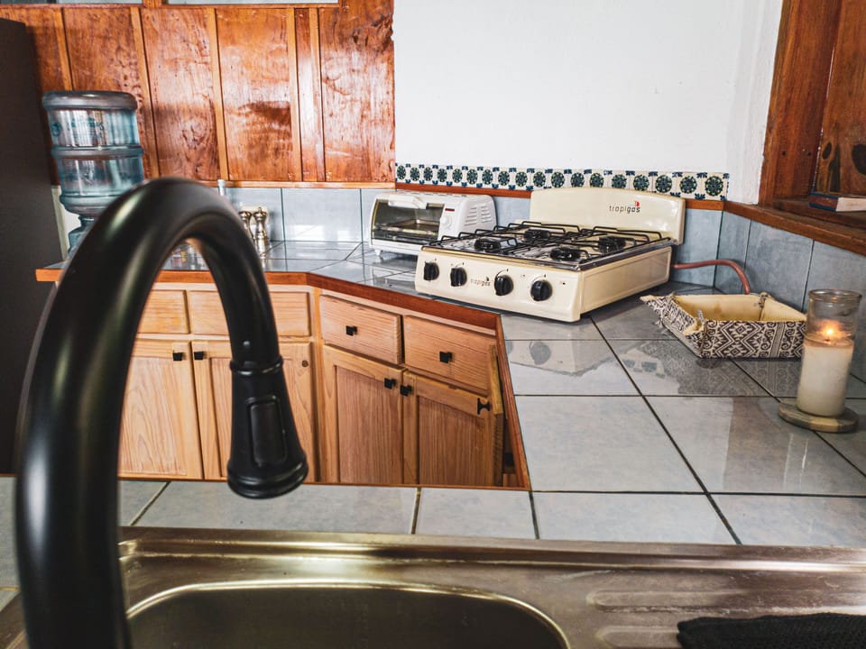 Our spacious and well-equipped kitchen features numerous appliances.