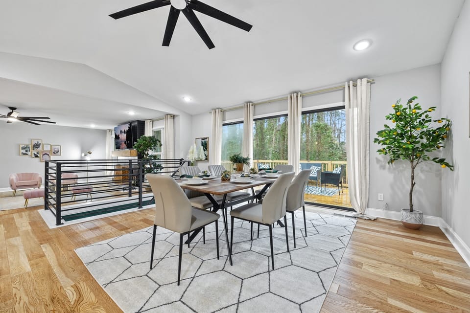 Dining Table that seats 6 comfortably and provides a beautiful tree and patio view.