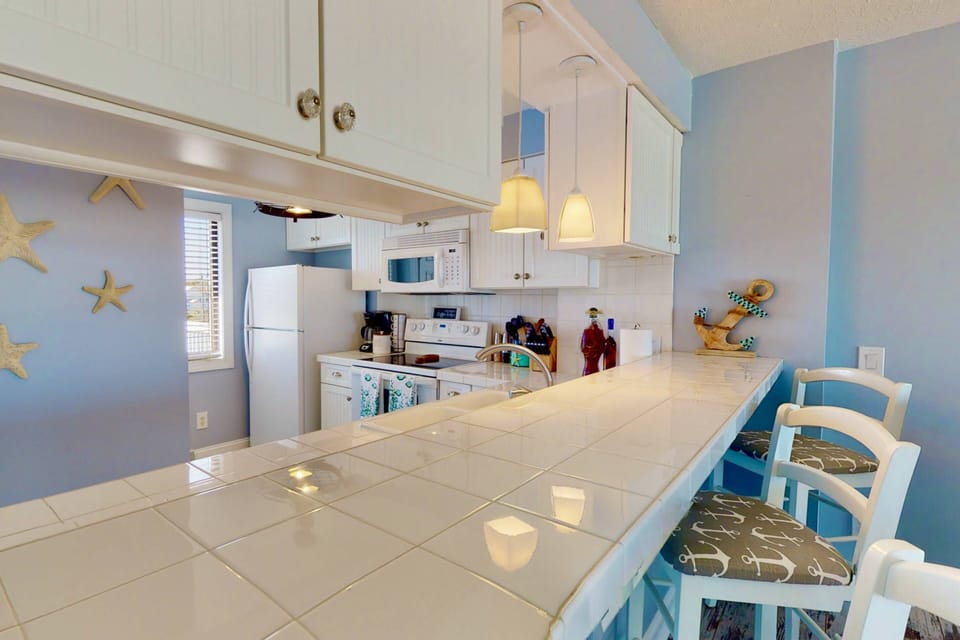 There is a large bar height countertop for additional seating and a great place for morning coffee or breakfast