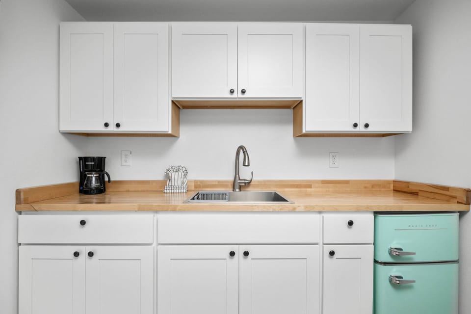 Enjoy a nice meal in the kitchenette area equipped with a mini-fridge, coffee maker, and microwave.