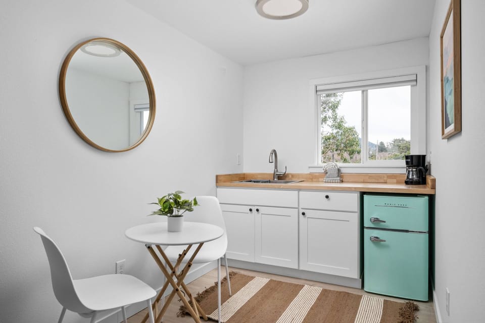 Enjoy a nice meal in the kitchenette area equipped with a mini-fridge, coffee maker, and microwave.