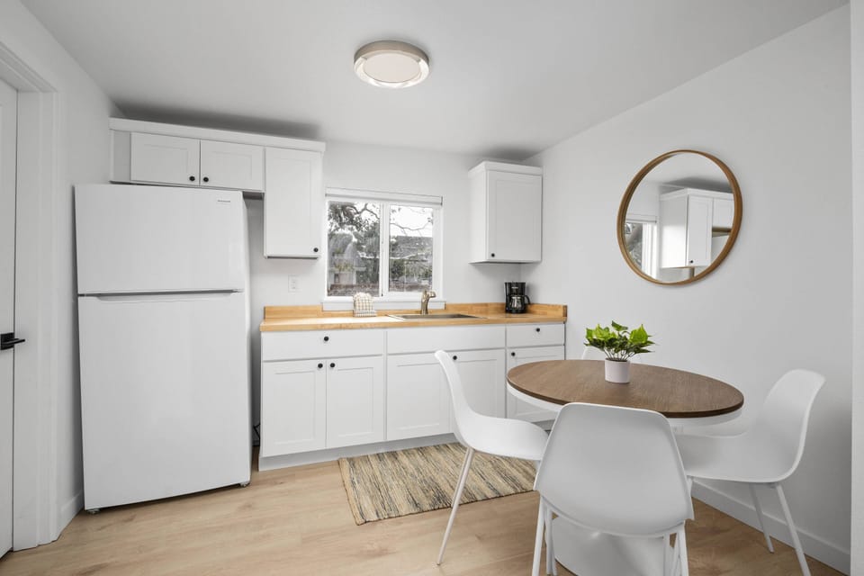 Enjoy a nice meal in the kitchenette area equipped with a mini-fridge, coffee maker, and microwave.