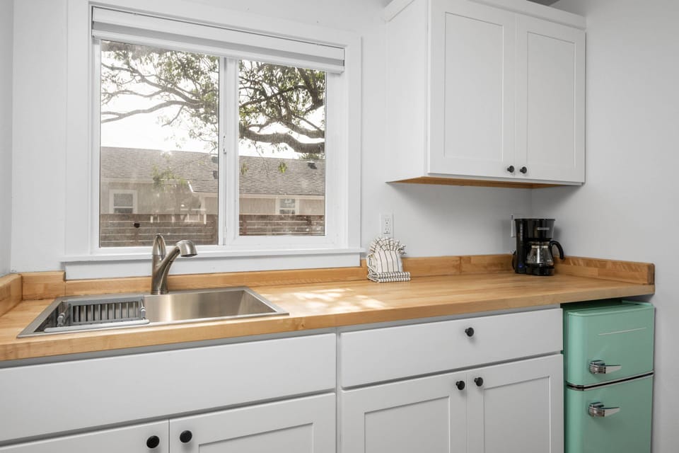 Enjoy a nice meal in the kitchenette area equipped with a mini-fridge, coffee maker, and microwave.