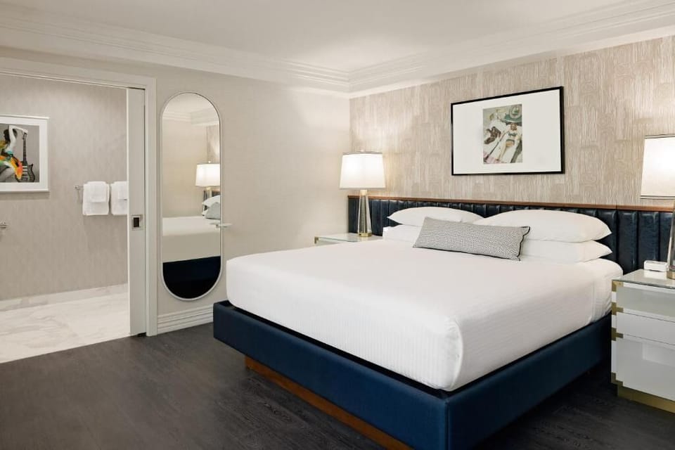 Recharge in a serene bedroom with soft lighting and luxe headboard.