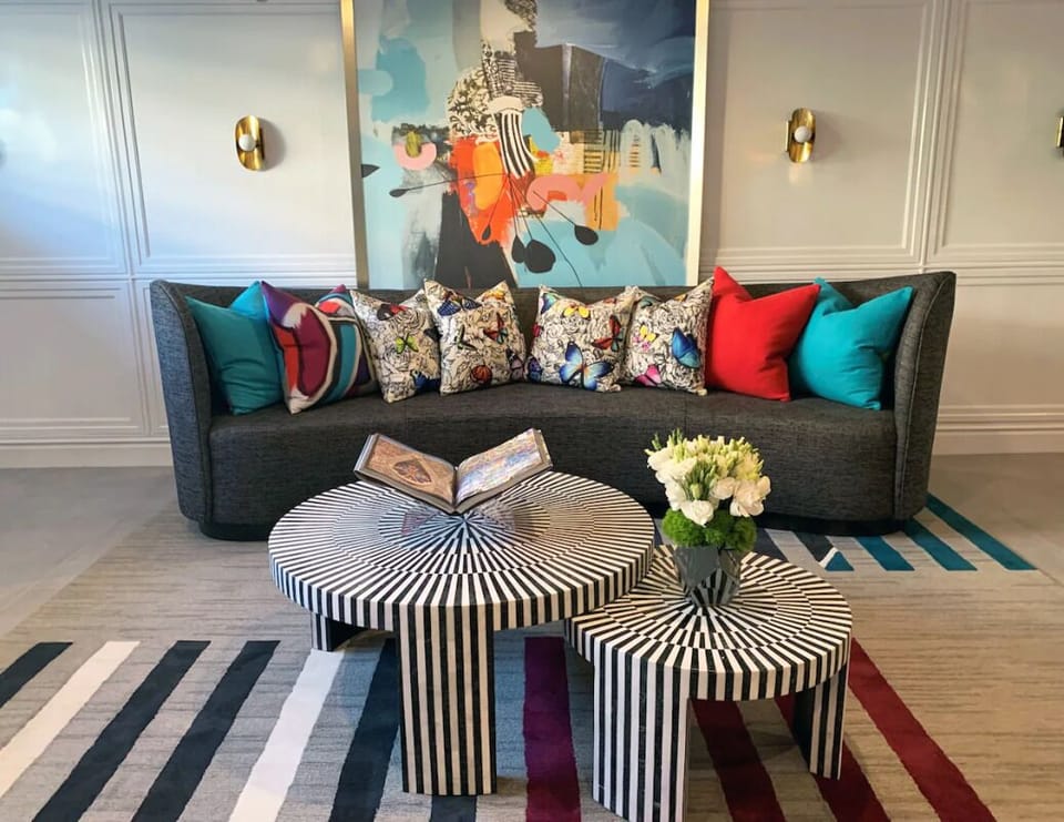 Enter a bright, art-filled lobby that feels instantly elevated.