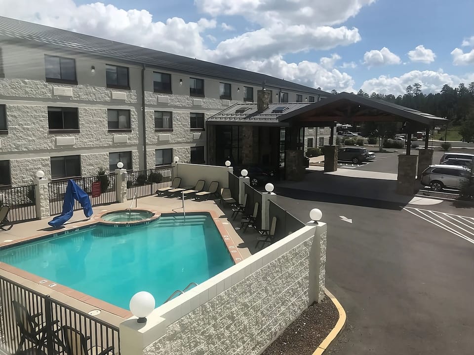 Lounge poolside with convenient access to the hotel entrance.