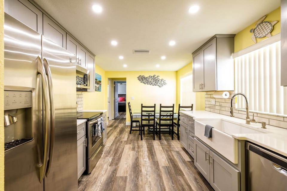 Quartz countertops and farm sink are some of the highlights of the kitchen 