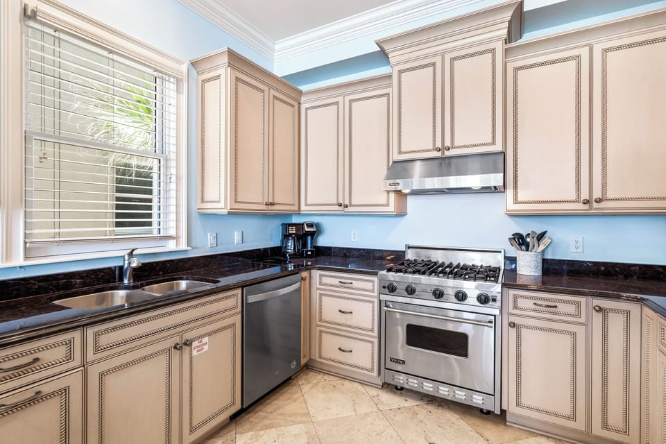 Amazing Kitchen with a Viking Gas Range, Stainless Steel Appliances, Granite Countertops and Custom Cabinetry.  Separate Ice Maker for Filling Up your Cooler!