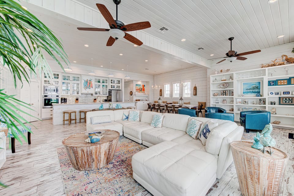Sink into this airy coastal haven where your mornings begin with ocean breezes and evenings unfold in pure comfort.