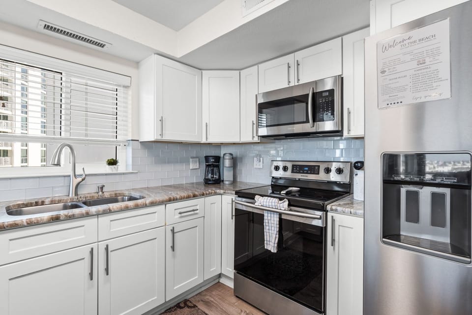 Kitchen with Stainless Steel appliances.