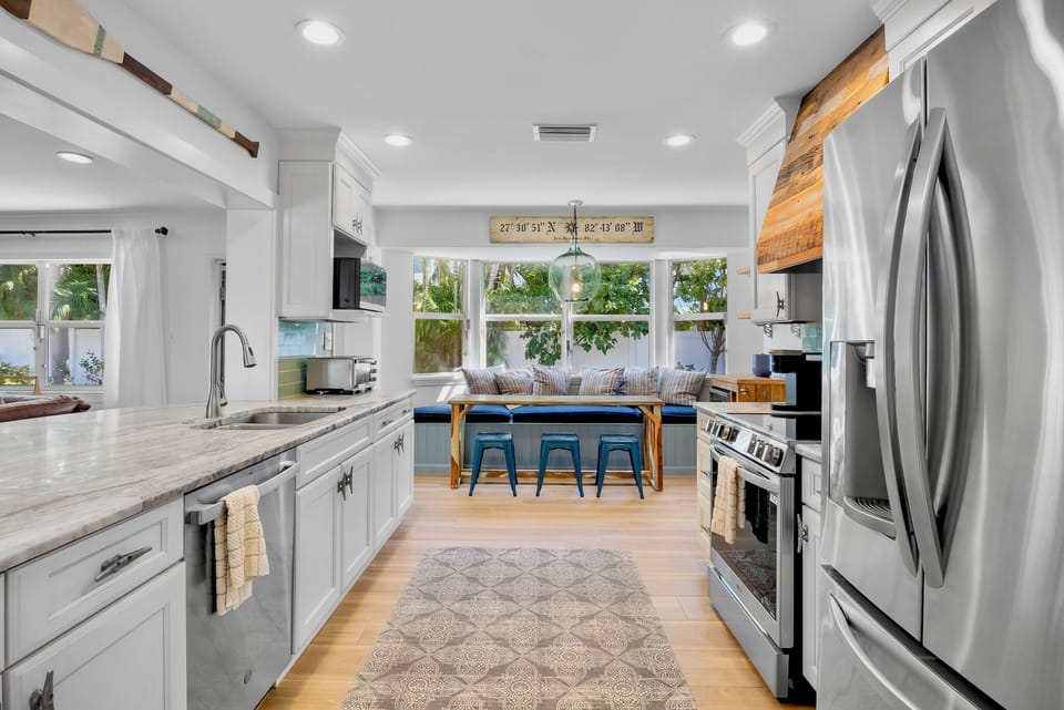 Fully equipped kitchen with bright breakfast nook