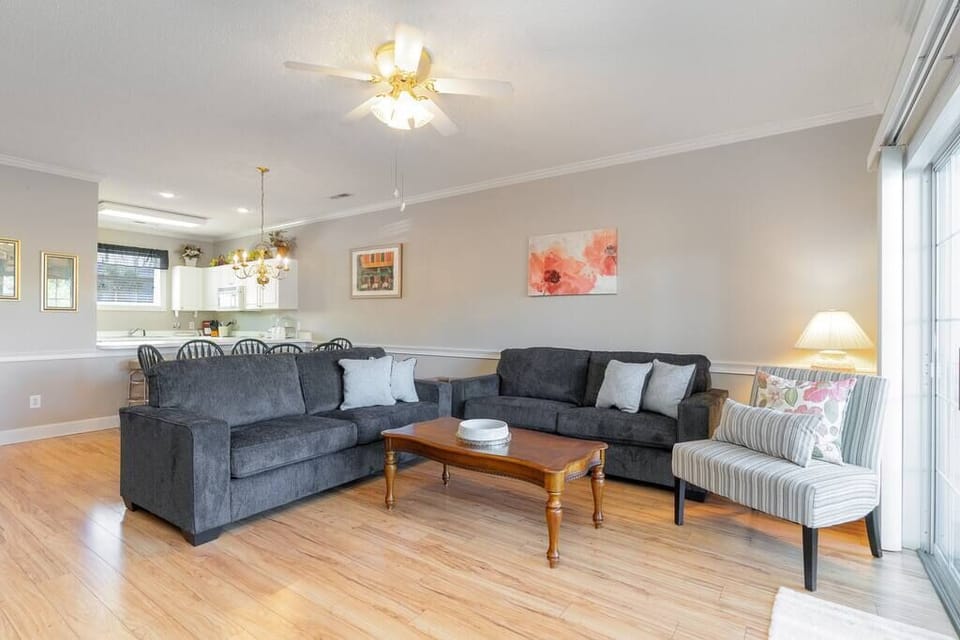 Sunny living room with sleeper sofa overlooking the golf course