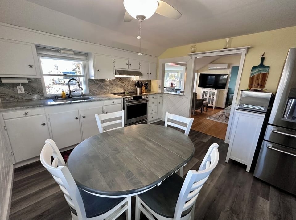 Kitchen looking into living room and sun room. - “Galley”