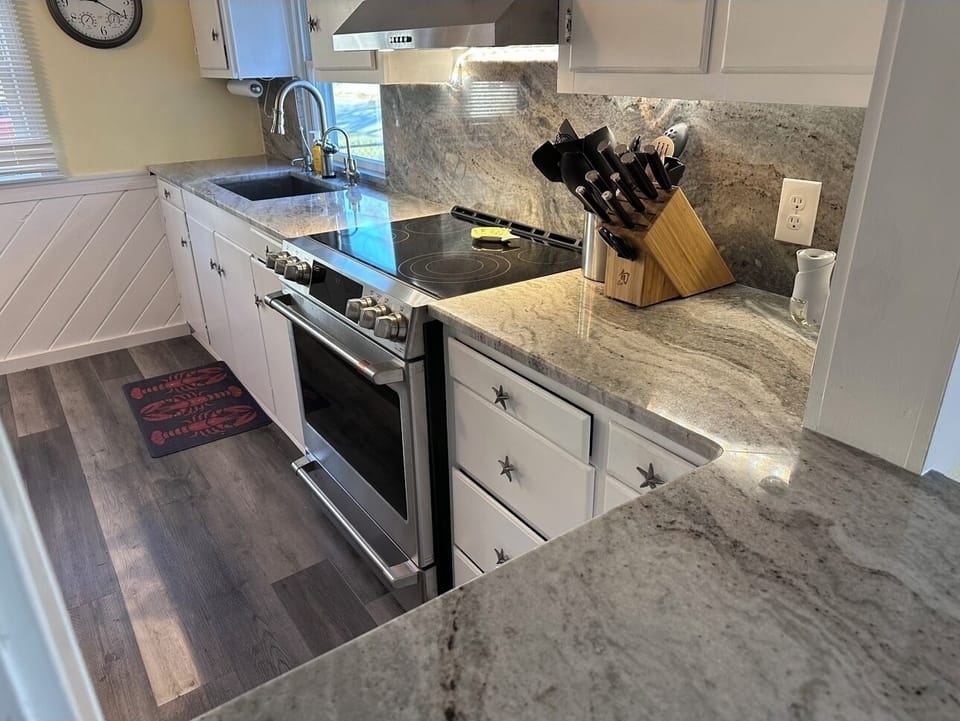 Kitchen showing GE CAFE Electric Range - “Galley”