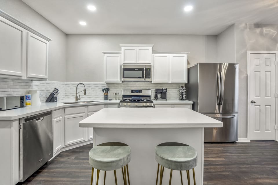 Our modern kitchen boasts high-end appliances and chic design.