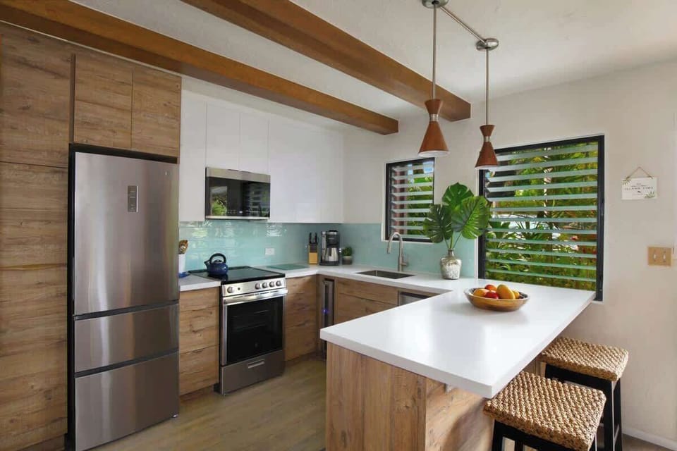 Chef-ready kitchen with premium appliances & breakfast bar seating