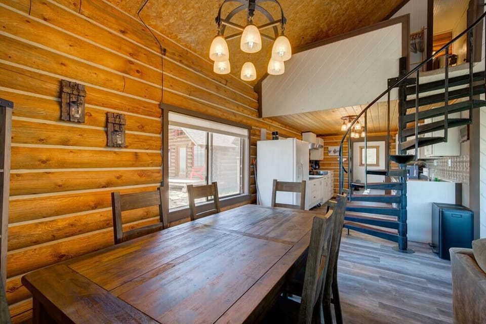 The dining area is off of the living room and kitchen and includes seating for six. 