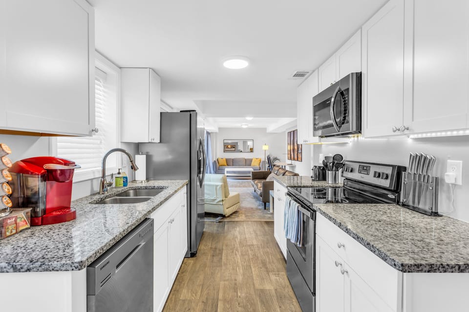 Downstairs fully stocked kitchen and large living room area!