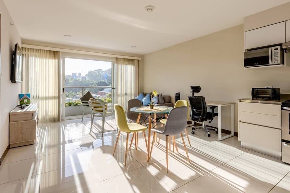 Living room with view, desk and work chair