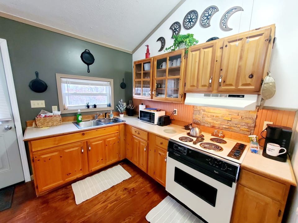 Kitchen offers a Keurig, waffle maker and all you need to make coffee & waffles.