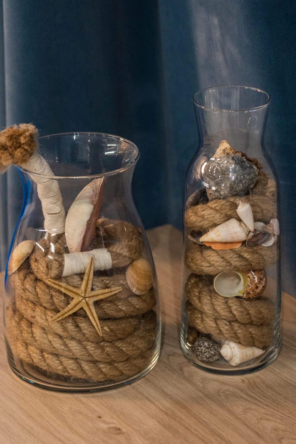 A close-up of a decorative set of jars filled with dried elements for a rustic touch.
