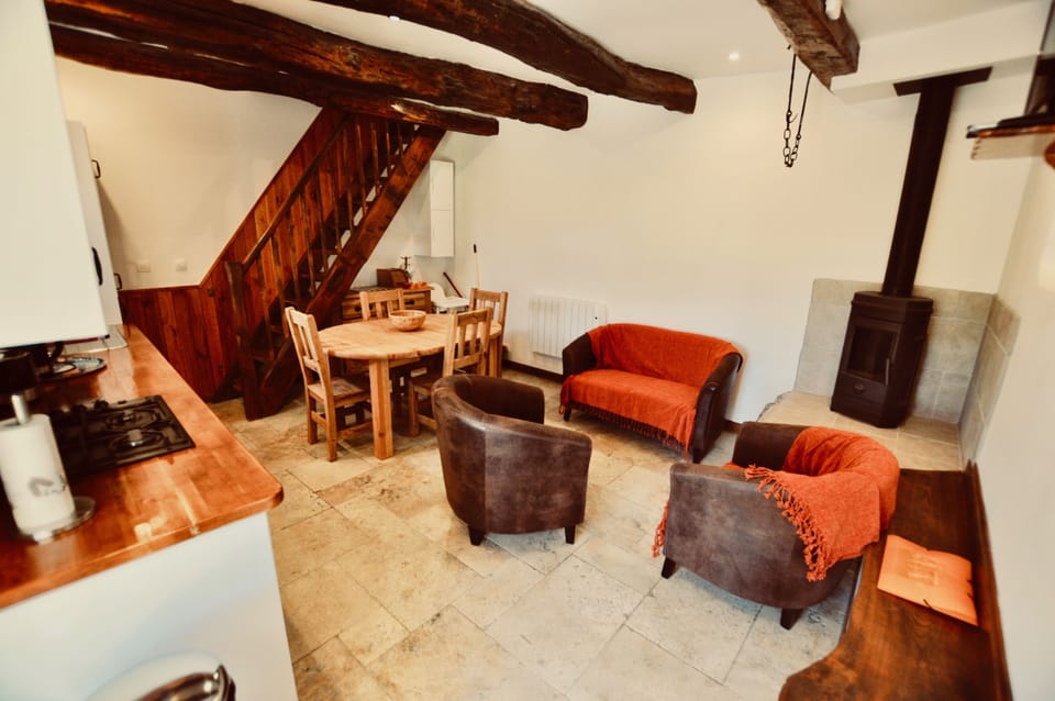 Living room with TV and log burner