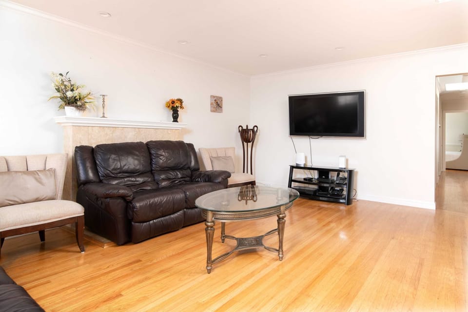 The living room has equally comfy sitting areas plus a TV ...