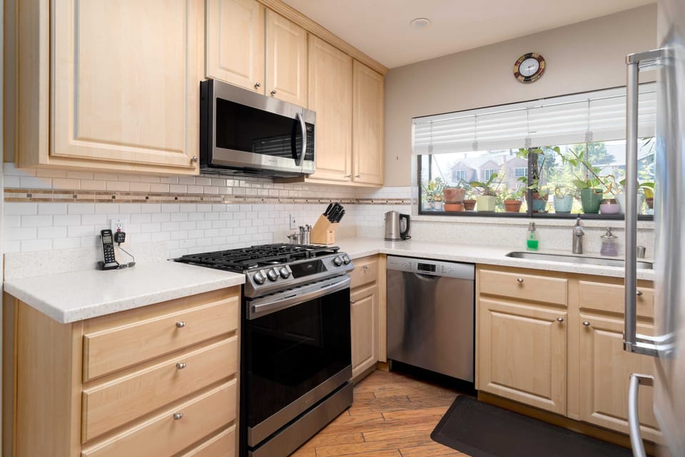 The kitchen is bright and comes fully equipped with appliances and cookware ...