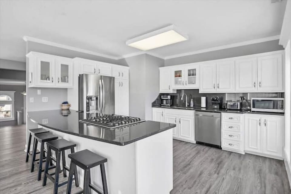 Peninsula counter with stool seating for four.