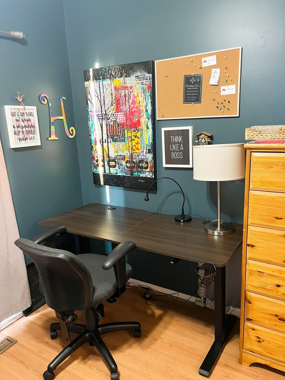 High adjustable desk in dedicated area with printer.