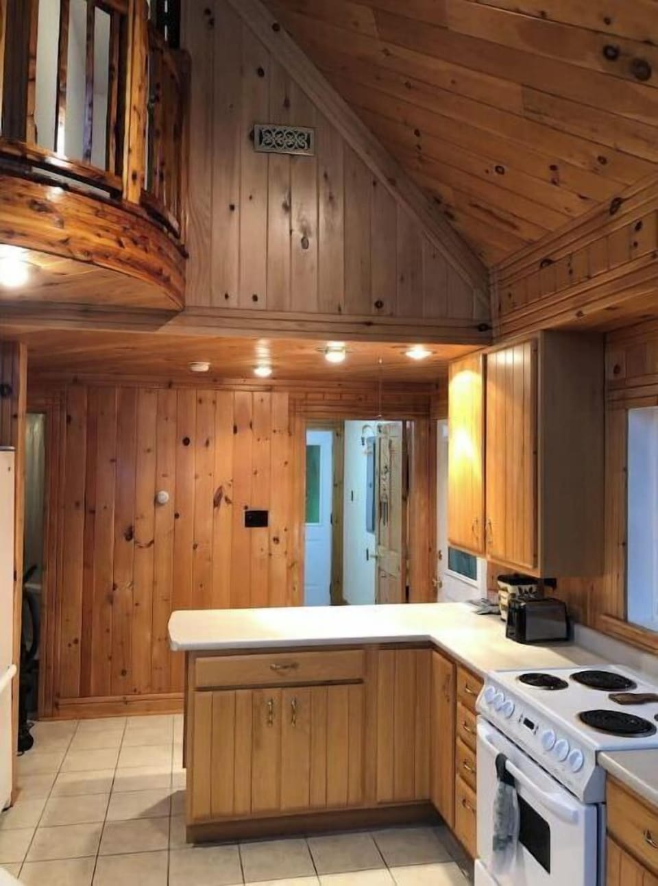 Kitchen with electric range, coffee maker, air fryer and blender