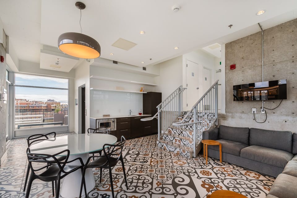 common area steps from suite; table, sectional, microwave, fridge & washroom